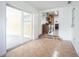 Bright living room featuring tile flooring, glass sliding door, and an open layout leading to the kitchen at 1807 23Rd N Ave, St Petersburg, FL 33713