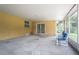 Large sunroom with tiled floor and windows overlooking a beautiful yard at 1807 23Rd N Ave, St Petersburg, FL 33713