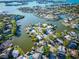 Stunning aerial view of waterfront homes, boat docks and canals of the community on the Gulf Coast at 2096 Church Creek Pt, Largo, FL 33774