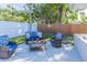Relaxing backyard patio area featuring comfortable seating and a well-maintained fence for privacy at 2096 Church Creek Pt, Largo, FL 33774