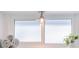 Window detail with bright daylight, towels and a plant adding warmth to the bathroom space at 2096 Church Creek Pt, Largo, FL 33774