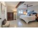 Bright bedroom featuring a beam, light walls, and matching nightstands at 2096 Church Creek Pt, Largo, FL 33774