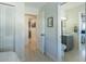 Hallway offers views to the bathroom and kitchen, with neutral walls and complementing floors at 2096 Church Creek Pt, Largo, FL 33774