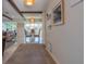 Bright interior showcasing an open floor plan connecting the living room, dining area, and a flood of natural light at 2096 Church Creek Pt, Largo, FL 33774