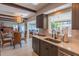 Well-equipped kitchen with quartz countertops, gray cabinets, and stainless steel appliances at 2096 Church Creek Pt, Largo, FL 33774