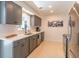 Stylish kitchen with new appliances, tiled backsplash, and quartz countertops at 2096 Church Creek Pt, Largo, FL 33774