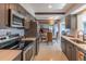 Updated kitchen with sleek countertops, gray cabinets, and stainless steel appliances at 2096 Church Creek Pt, Largo, FL 33774