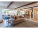 Open-concept living room with a comfortable sofa, area rug, and seamless flow to the kitchen at 2096 Church Creek Pt, Largo, FL 33774