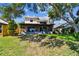 Backyard exterior with a screened in porch at 2199 Springrain Dr, Clearwater, FL 33763