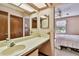 Bathroom boasts an extended vanity, lots of natural light, and a view of the bedroom at 2199 Springrain Dr, Clearwater, FL 33763
