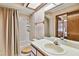 Bathroom featuring a shower and tub, along with a vanity at 2199 Springrain Dr, Clearwater, FL 33763