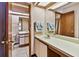 Bathroom featuring an extended vanity, and a toilet in the adjacent room at 2199 Springrain Dr, Clearwater, FL 33763