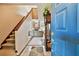 Inviting foyer with staircase, tiled floors, and a view of the living room with a fireplace at 2199 Springrain Dr, Clearwater, FL 33763