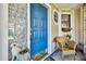 Charming entryway with a blue front door, decorative accents, and a welcoming porch area at 2199 Springrain Dr, Clearwater, FL 33763