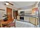 Well-equipped kitchen with stainless steel appliances and an adjacent dining area at 2199 Springrain Dr, Clearwater, FL 33763
