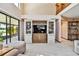 Living room featuring an entertainment center and access to a screened porch at 2199 Springrain Dr, Clearwater, FL 33763
