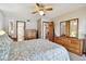 Well-lit main bedroom with ceiling fan and furnishings at 2199 Springrain Dr, Clearwater, FL 33763