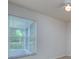 Bright bedroom featuring a window with blinds and a ceiling fan at 25323 Lexington Oaks Blvd, Wesley Chapel, FL 33544