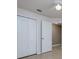 Bedroom with a double door closet and doorway to the next room at 25323 Lexington Oaks Blvd, Wesley Chapel, FL 33544