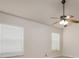 Bedroom featuring neutral walls, carpet flooring, a ceiling fan, and windows that provide natural light at 25323 Lexington Oaks Blvd, Wesley Chapel, FL 33544