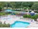 A well-equipped community pool area with a splash pad, multiple slides, and ample seating at 25323 Lexington Oaks Blvd, Wesley Chapel, FL 33544