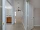 Hallway view of open floor plan that leads to the main bedroom, bathroom, and walk in closet at 25323 Lexington Oaks Blvd, Wesley Chapel, FL 33544
