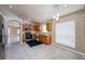 Open kitchen with light wood cabinets, tile floors, and eat-in dining at 25323 Lexington Oaks Blvd, Wesley Chapel, FL 33544