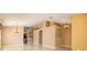 Open-concept living area with tile flooring, neutral paint and transitional light fixtures at 25323 Lexington Oaks Blvd, Wesley Chapel, FL 33544