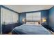 Comfortable bedroom featuring large windows, lots of natural light and sleek decor at 2572 Forest Run Ct, Clearwater, FL 33761