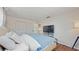 Well-lit bedroom featuring lots of natural light and an entertainment center at 2572 Forest Run Ct, Clearwater, FL 33761