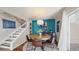 Cozy dining room with wooden table, staircase and light, offering a perfect space for Gathering meals at 2572 Forest Run Ct, Clearwater, FL 33761