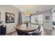Inviting dining room featuring a round table, wood floors and natural light perfect for gatherings at 2572 Forest Run Ct, Clearwater, FL 33761