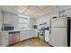 Efficient kitchen with white cabinets, stainless steel appliances, and ample counter space at 2572 Forest Run Ct, Clearwater, FL 33761
