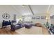 Bright living room with wood floors, high ceilings, modern furniture and large windows at 2572 Forest Run Ct, Clearwater, FL 33761