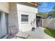 Private patio features outdoor seating, mature landscaping and a relaxing space at 2572 Forest Run Ct, Clearwater, FL 33761