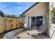 Outdoor patio with seating, mature plantings, privacy fence and a relaxing space at 2572 Forest Run Ct, Clearwater, FL 33761