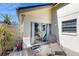 Outdoor patio with lounge chairs, dining space, and access to interior sliding door at 2572 Forest Run Ct, Clearwater, FL 33761