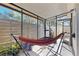 Relaxing screened patio with hammock, seating area, and outdoor access at 2572 Forest Run Ct, Clearwater, FL 33761