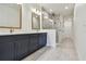 Modern bathroom with double vanity, stylish fixtures, and a glass-enclosed shower at 2832 Marrakesh Ln, Sarasota, FL 34234