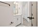 Bathroom featuring white vanity, neutral paint, gold mirror and light fixtures at 2832 Marrakesh Ln, Sarasota, FL 34234