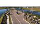 Picturesque community entrance with palm trees, water features, and lush landscaping at 2832 Marrakesh Ln, Sarasota, FL 34234