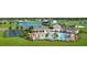 Resort-style community pool with cabanas, tennis courts, clubhouse, and pond views create an inviting atmosphere for residents at 2832 Marrakesh Ln, Sarasota, FL 34234