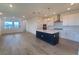 Bright, open-concept kitchen featuring a large island, modern appliances, and pendant lighting at 2832 Marrakesh Ln, Sarasota, FL 34234