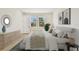 Bright main bedroom with neutral tones, contemporary decor, and an ensuite bathroom at 2832 Marrakesh Ln, Sarasota, FL 34234