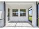 Covered patio with pavers, providing a shaded outdoor area with natural light at 2832 Marrakesh Ln, Sarasota, FL 34234