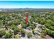 An aerial view of a home and surrounding neighborhood with mature trees and lush landscaping at 3106 E 25Th Ave, Tampa, FL 33605