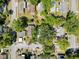 Aerial view of tree-covered neighborhood, offering a sense of the property's location and surroundings at 3106 E 25Th Ave, Tampa, FL 33605