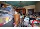 Cluttered room filled with boxes and assorted items, showing deferred maintenance and possible restoration needs at 3106 E 25Th Ave, Tampa, FL 33605