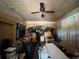 Cluttered room with boxes and furniture, a property needing major restoration and clearing at 3106 E 25Th Ave, Tampa, FL 33605