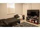 Bedroom with two beds, window, television, and closet door at 314 E Althea Ave, Tampa, FL 33612